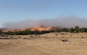 Fog, seen here receding in the morning, comes and goes quietly in the Namib Desert.