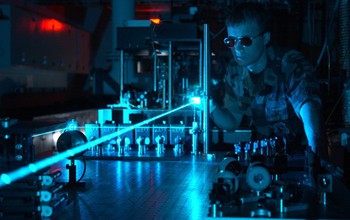 man using laser in a lab
