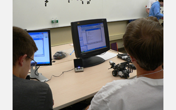 Photo of visually impaired students working through a computing challenge at ImagineIT.