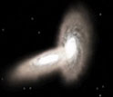 Screen capture of simulation showing two colliding galaxies.