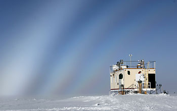 Photo of sky with fog bows over summit station in greenland