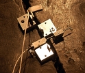 A close-up view of the MicroStrain NANO-DVRT wireless sensors clamped to the Liberty Bell.
