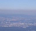 Haze obscures many urban areas, like Frankfurt, Germany.
