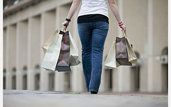 Photo of woman holding shopping bags.