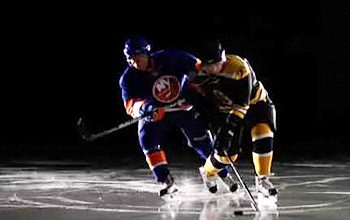 Two hockey players smashing into each other