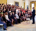 Photo of President Obama greeting teachers in the East Room of the White House.