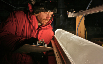 Scientists examine an ice core