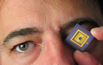 Vladimir Brajovic holding an image sensor similar to proposed chip