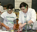 Photo of girls from the Expanding Your Horizons Conference enjoying a hands-on workshop.