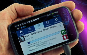 Photo illustration showing a hand holding an Android-based smartphone and pulsars in the background