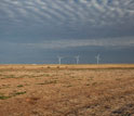 Photo showing a wind-farm on the horizon in Lubbock County, Texas.