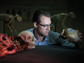 Alistair Evans examines hominin skull casts