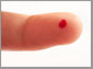 a drop of blood on a finger