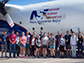 UM and Colorado State University students pose in front of their flying laboratory