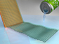 a can of soda water being poured on a sheet of graphene