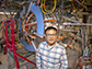 Jongsoo Yoo stands next to the Magnetic Reconnection Experiment