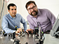 Alireza Marandi, left, and Marc Jankowski prepare to carry out experiments at the optical bench