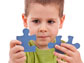 photo of a child holding two puzzle pieces