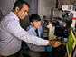 Ankur Singh, left, works in his lab with Sungwoong Kim